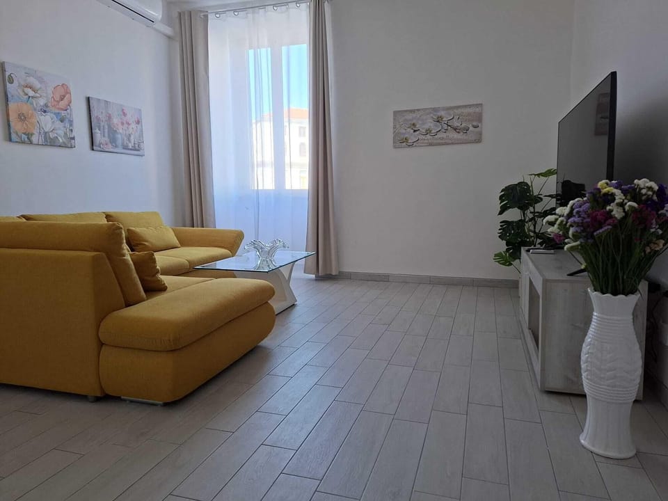Apartment, Balcony, Partial Sea View | Living area | 65-inch Smart TV with satellite channels