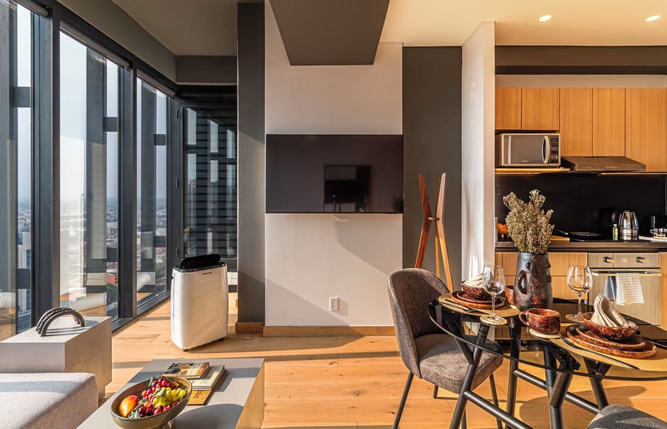 Deluxe Suite, City View | Living area | 55-inch Smart TV with digital channels