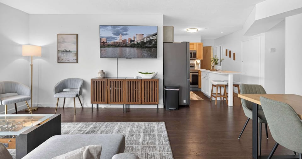 Modern open layout with cozy furnishings and sleek finishes creating a comfortable home-away-from-home feel.