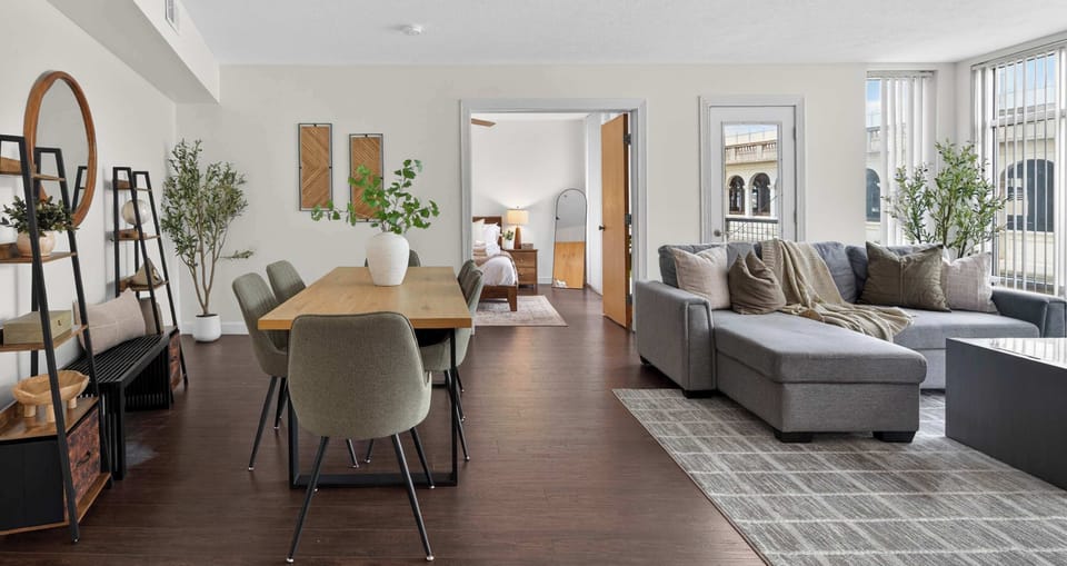 Bright open-concept layout with cozy seating and natural light creating a spacious and welcoming feel.