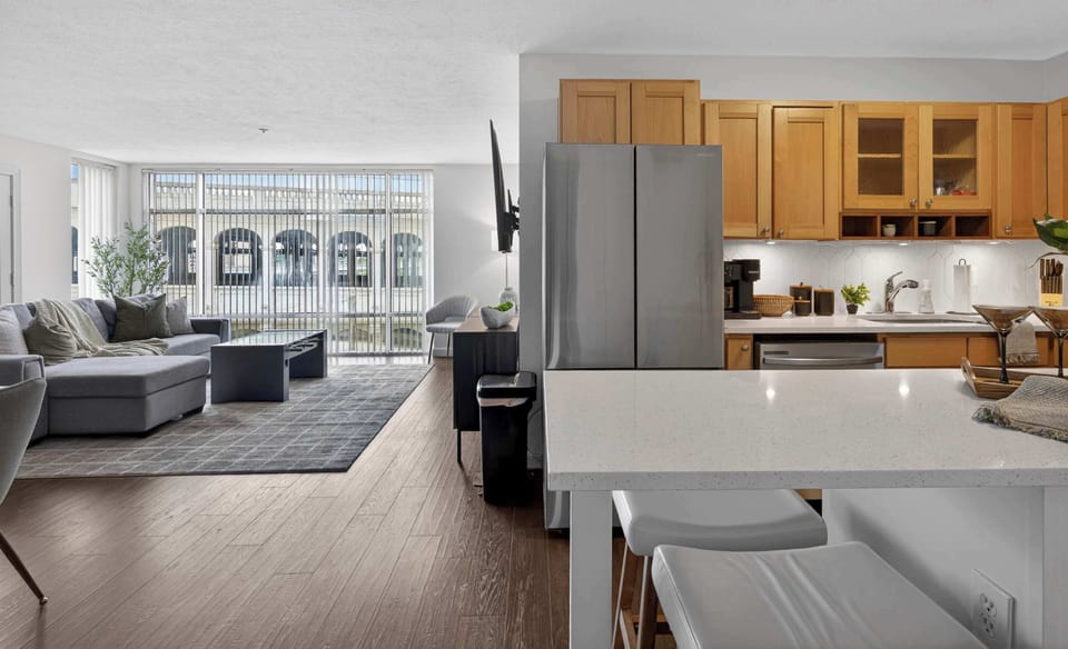 Spacious kitchen and lounge layout with seamless flow and cozy interiors ideal for gathering and unwinding together.
