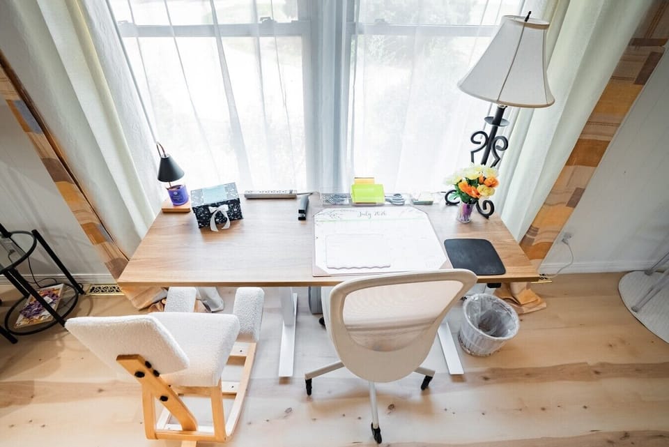 Bright, airy, and built for comfort. The open-plan living area includes a beautifully integrated workstation nook. Bathed in soft, natural light, it offers ample room for an ergonomic chair and a posture-supporting kneeling stool, making wellness-focused 