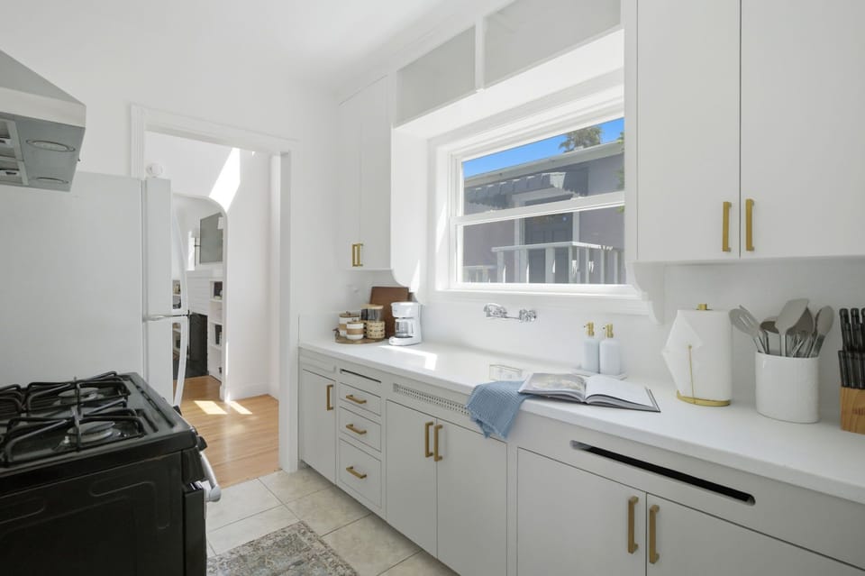 Bright, airy, and intentionally designed, this kitchen invites guests to gather, cook, and feel completely at home.