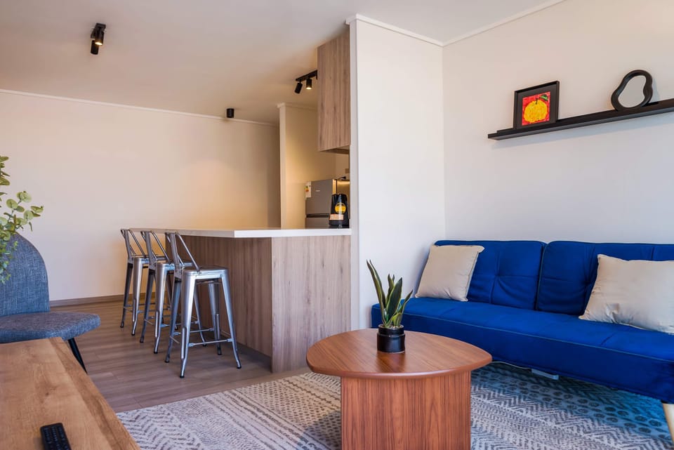 Cozy and modern living area with a stylish kitchen island, perfect for relaxing or entertaining.