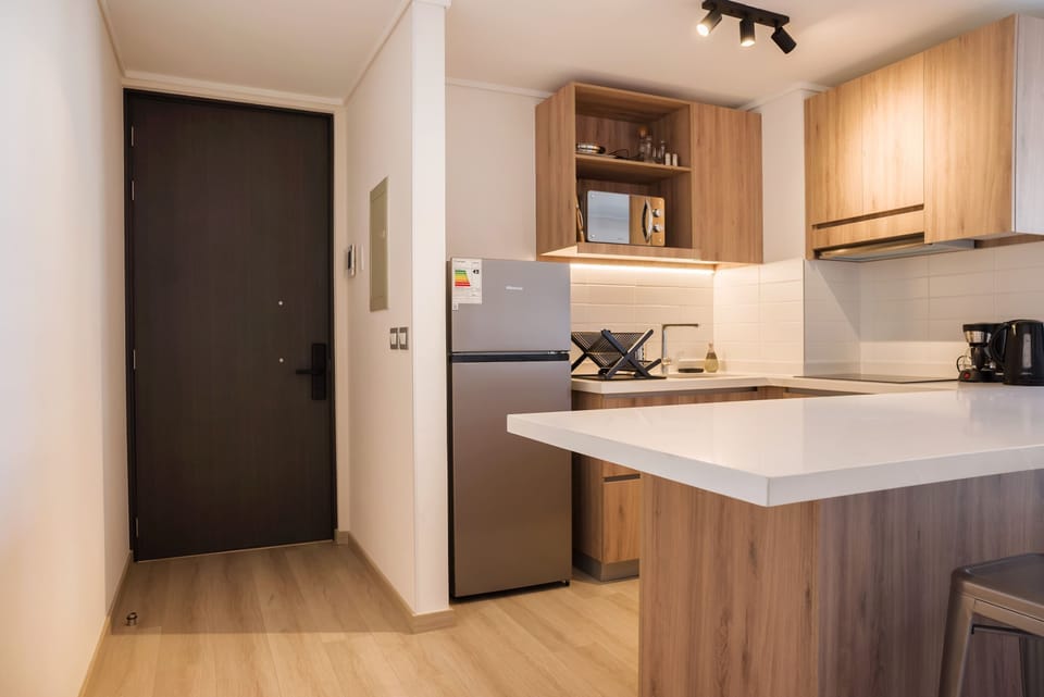 Sleek and modern kitchen with all essentials for a comfortable stay.