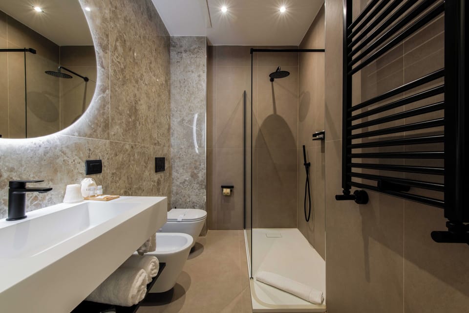 Deluxe Double Room, City View | Bathroom | Shower, hair dryer, slippers, towels