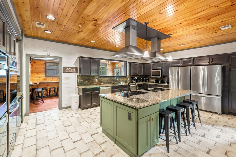 Group Kitchen -Four ovens, two stove tops, and counter space built for feeding a crowd. Whether you're catering in or cooking together, this kitchen handles 60+ guests without a bottleneck.