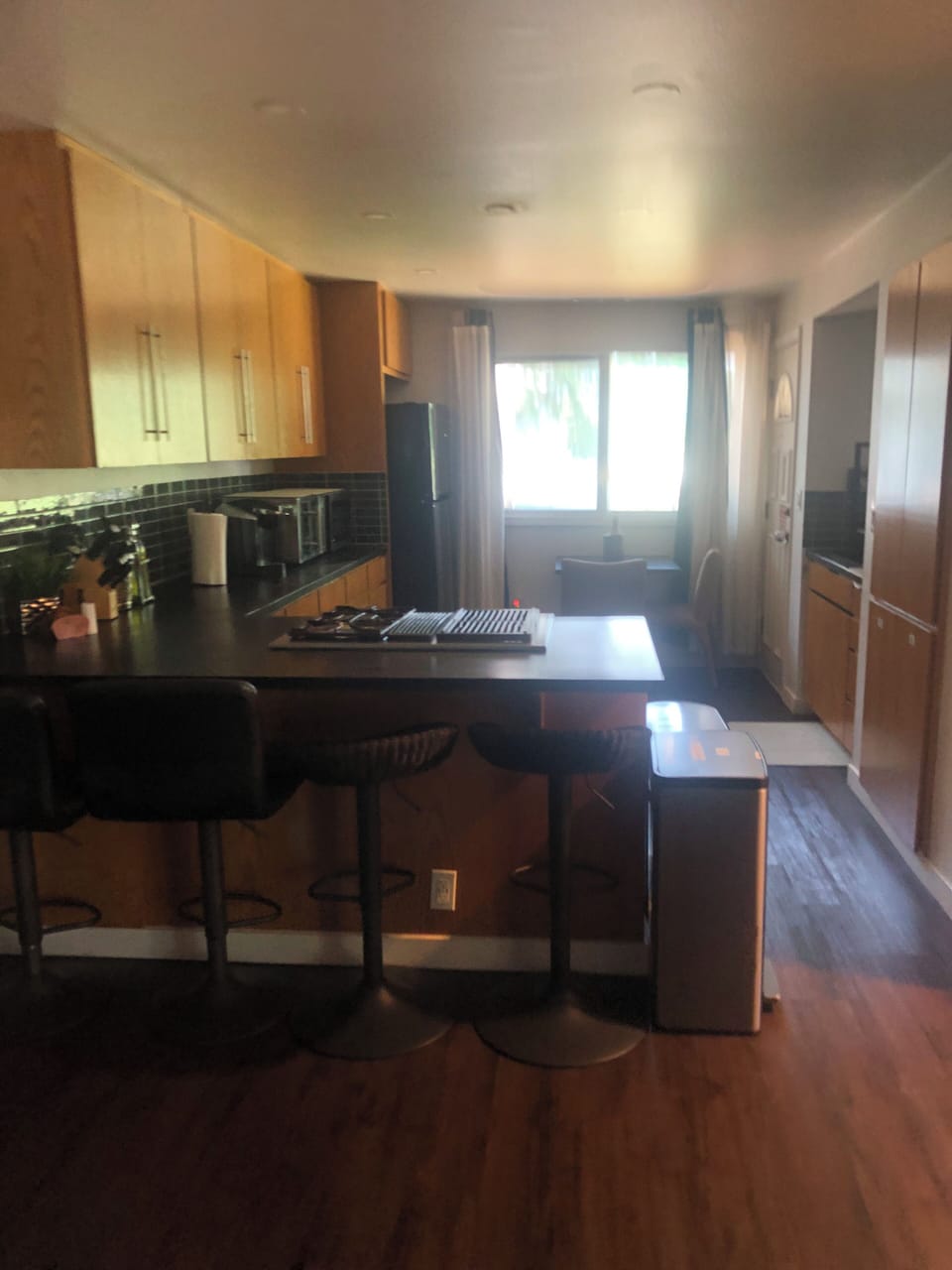 Bright open kitchen with breakfast bar seating and ample cabinet space