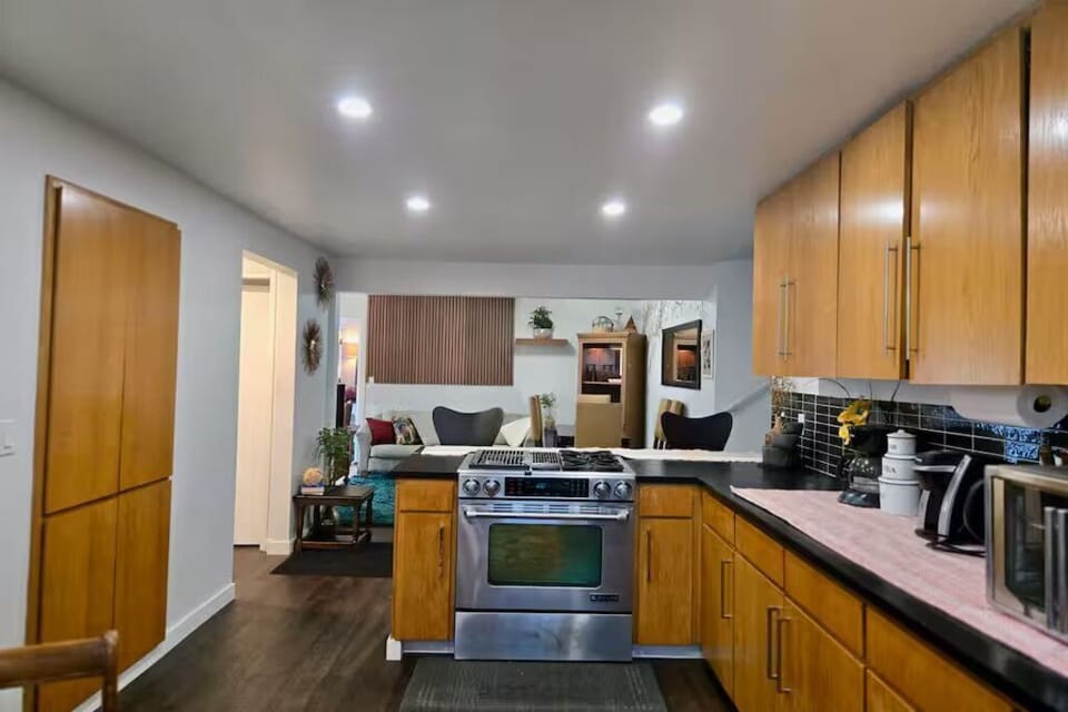 Fully equipped kitchen with modern appliances, generous counter space, and an open layout overlooking the living area. Perfect for preparing home-cooked meals while staying connected with family and friends.