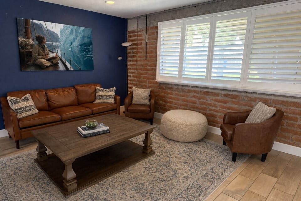 Cozy Living Room with Exposed Brick Accent Wall & Natural Light