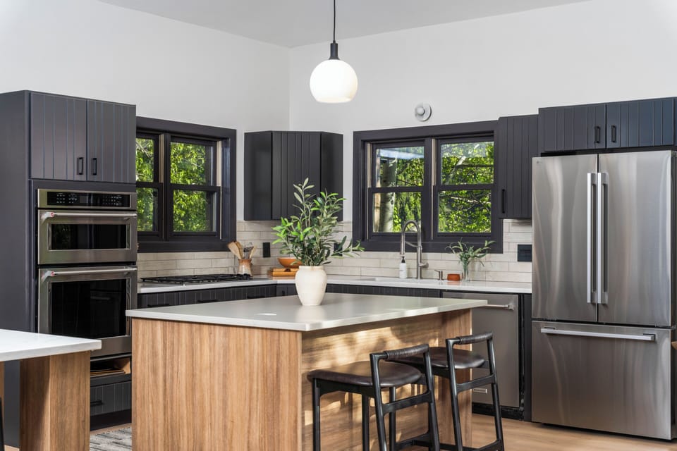 Beautiful open kitchen with island and ample counter space for the whole family.