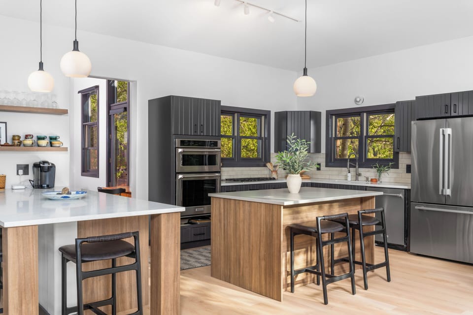 Featuring a showpiece chef's kitchen, private hot tub, expansive decks, and beautifully curated living spaces