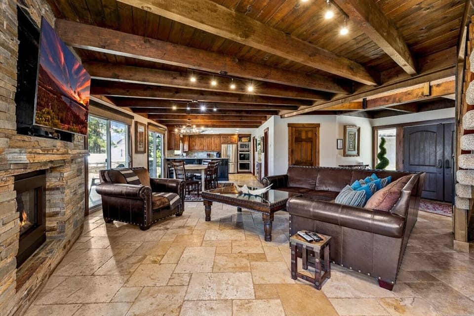 Downstairs living room with gas fireplace, smart TV overlooking the Tahoe keys