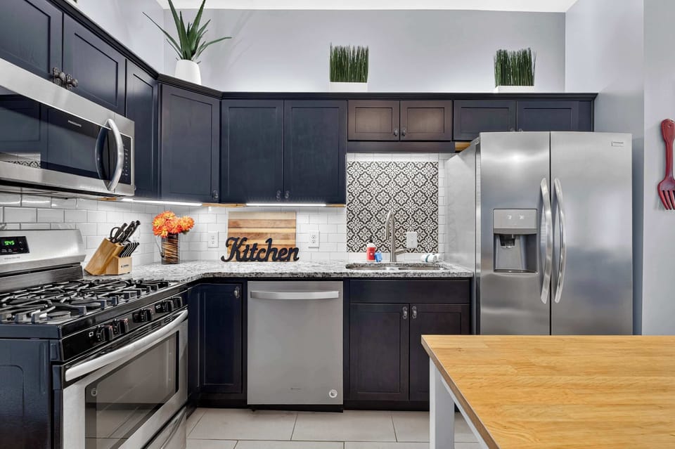 Kitchen: Enjoy a spacious kitchen and dining space designed for convenience, featuring modern appliances, generous workspace, and comfortable seating.