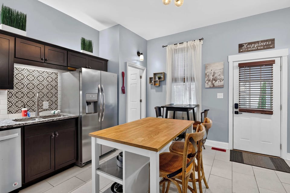 Kitchen: Enjoy a spacious kitchen and dining space designed for convenience, featuring modern appliances, generous workspace, and comfortable seating.