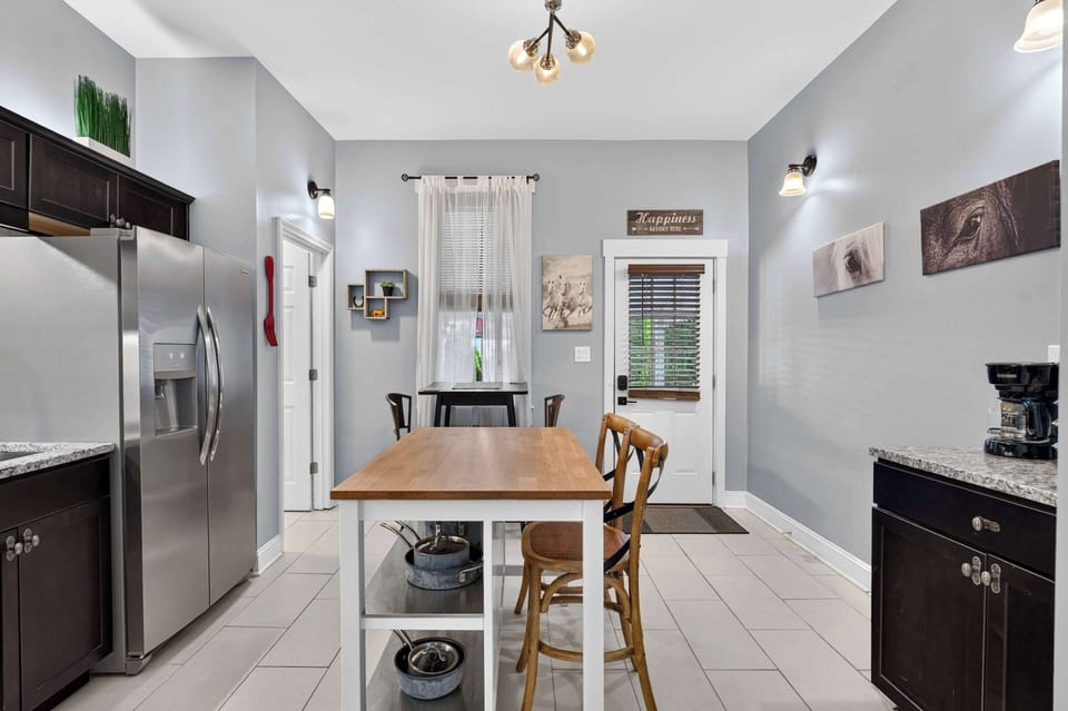 Kitchen: Enjoy a spacious kitchen and dining space designed for convenience, featuring modern appliances, generous workspace, and comfortable seating.