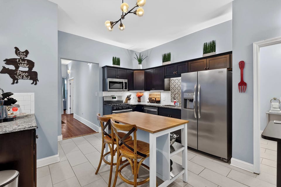 Kitchen: Enjoy a spacious kitchen and dining space designed for convenience, featuring modern appliances, generous workspace, and comfortable seating.