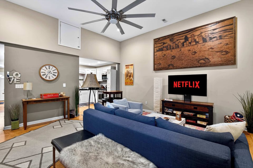 Living Room: Spacious living area with cozy furnishings, natural light, and modern touches. A comfortable space to unwind, socialize, or enjoy a movie night.