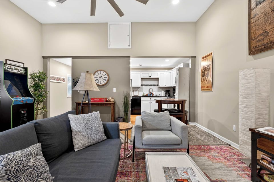 Living Room: Spacious living area with cozy furnishings, natural light, and modern touches. A comfortable space to unwind, socialize, or enjoy a movie night.