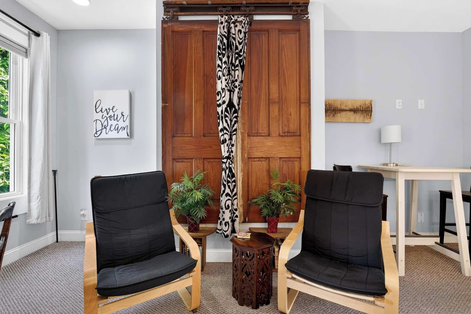 Living Room 2: This inviting seating nook offers a comfortable place to relax, chat with friends, or enjoy a quiet moment with your favorite book.