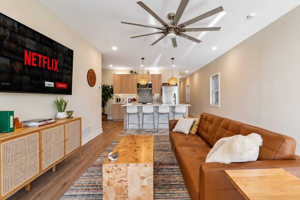 Living Room: Relax in this bright and cozy living room featuring comfortable seating, tasteful décor, and a welcoming atmosphere perfect for unwinding after a day of exploring.