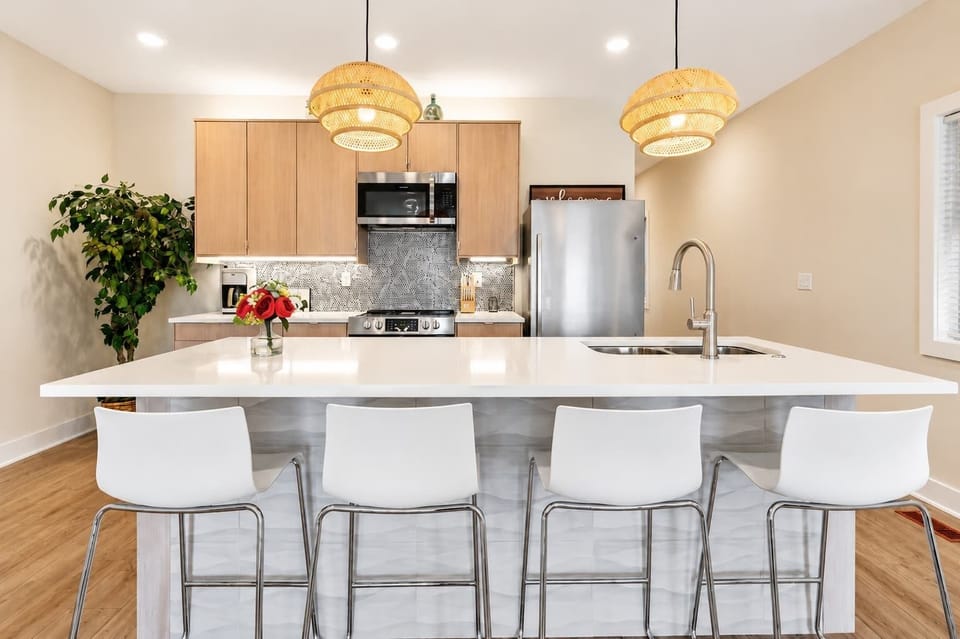 Kitchen: Bright and fully equipped kitchen with modern appliances, ample counter space, and everything you need to cook a comfortable meal during your stay.