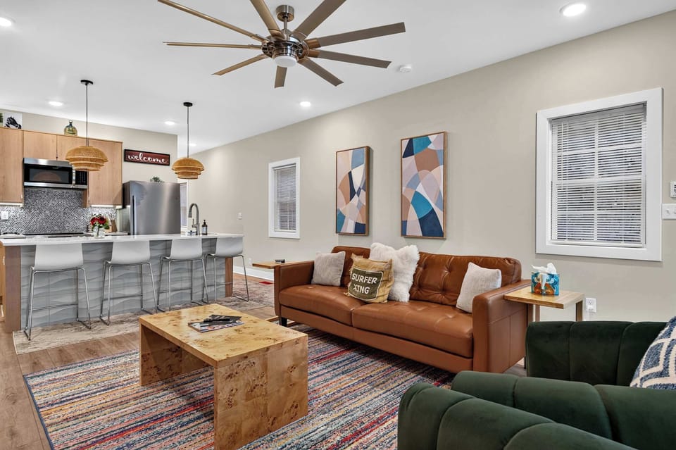 Living Room: Relax in this bright and cozy living room featuring comfortable seating, tasteful décor, and a welcoming atmosphere perfect for unwinding after a day of exploring.