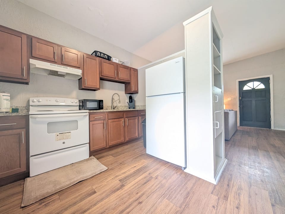Full kitchen with oven and refrigerator