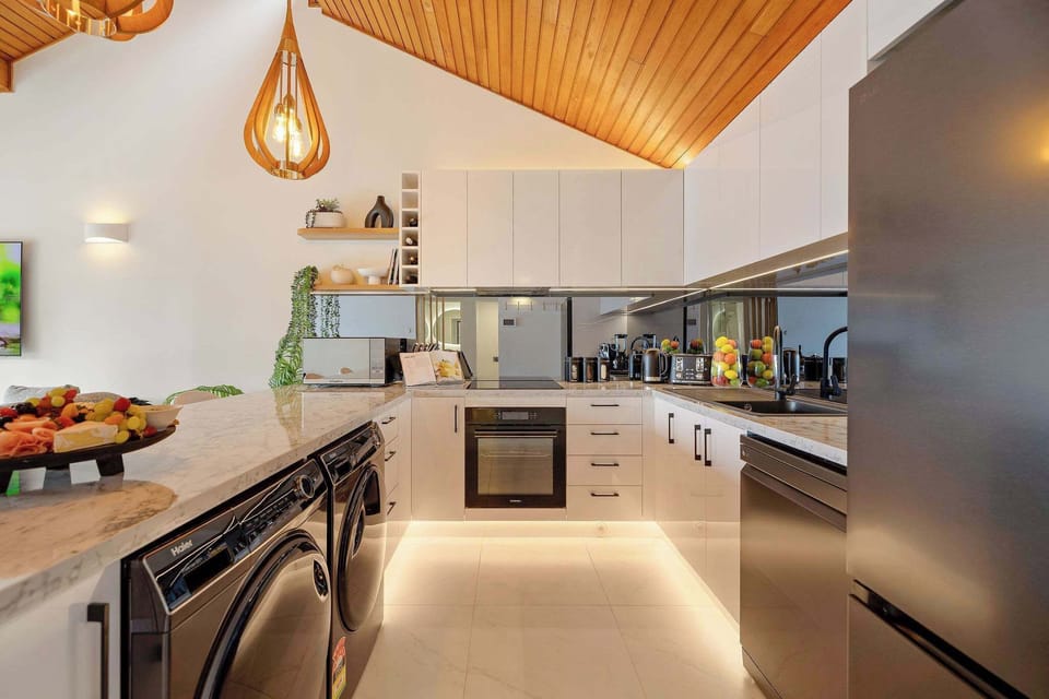 Gourmet Kitchen: Modern elegance awaits with sleek appliances and stylish decor—cook up a feast!