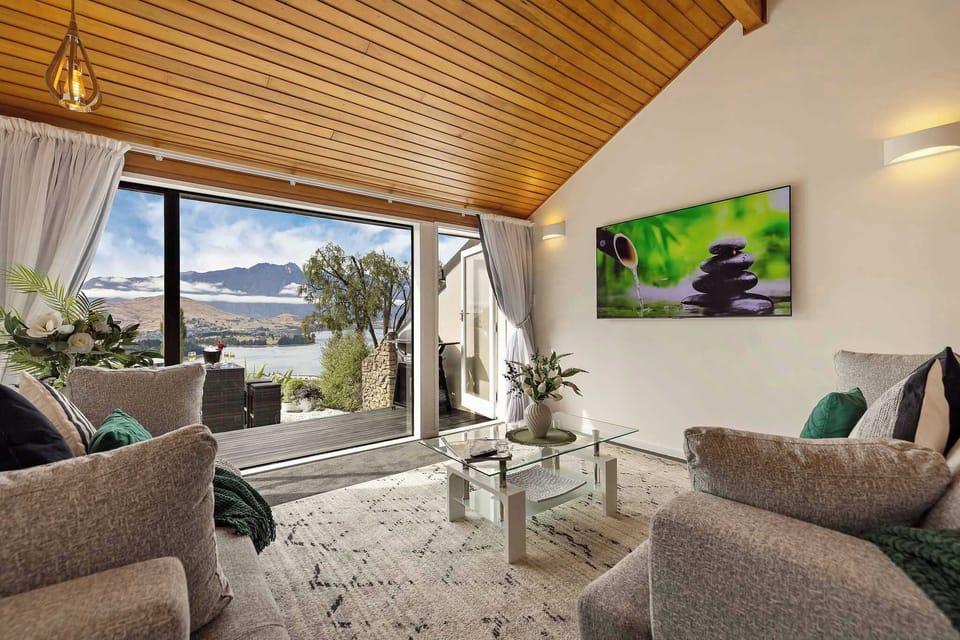 Living Room: Expansive views greet you in this stylishly appointed retreat!