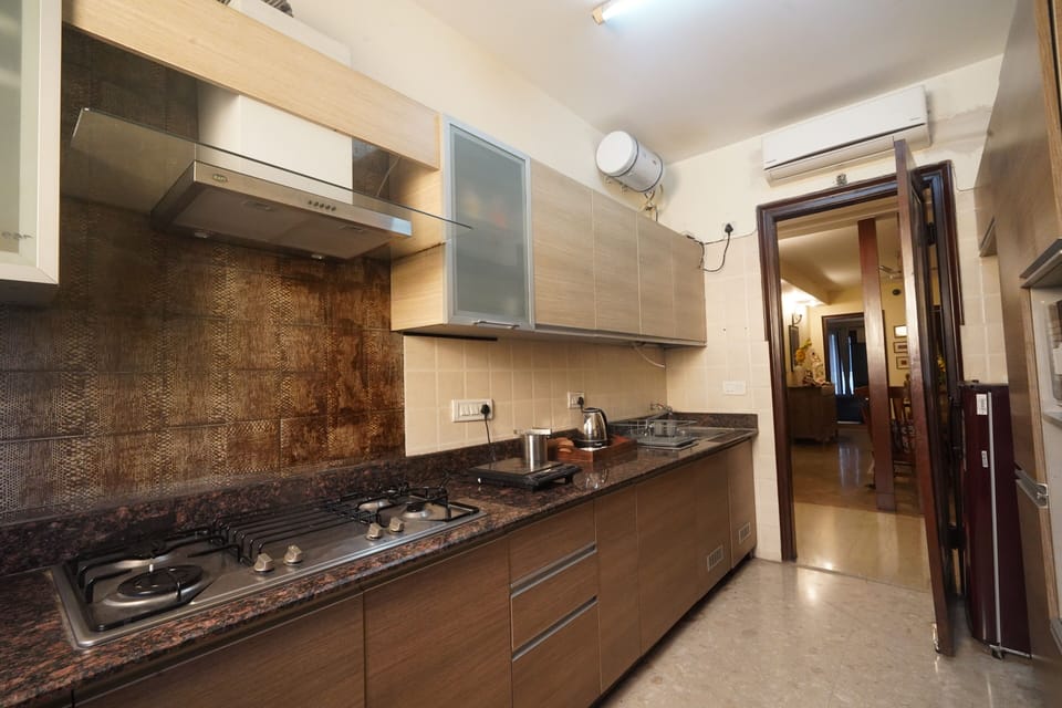 Apartment | Private kitchen | Full-size fridge, coffee/tea maker