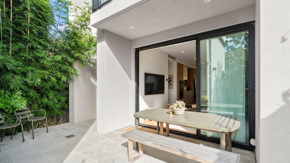 Private outdoor balcony with seating, perfect for morning coffee or evening relaxation