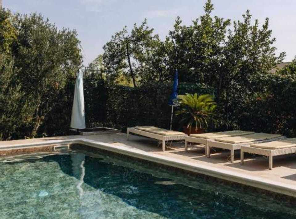 Apartment (Three Bedroom Apartment with Sea View) | Outdoor pool | Seasonal outdoor pool, pool umbrellas, sun loungers