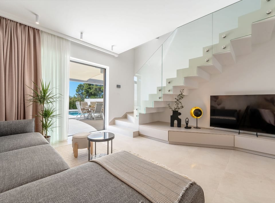 House (Villa Axia with pool) | Living room | 32-inch flat-screen TV with satellite channels