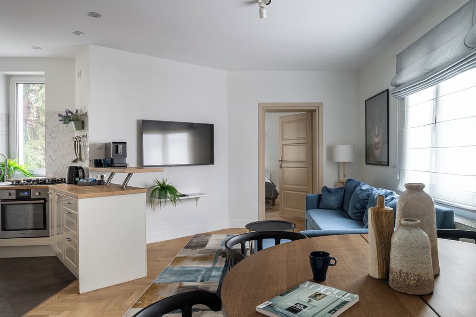 Deluxe Apartment, Balcony, Beachside | Living area | 40-inch flat-screen TV with cable channels