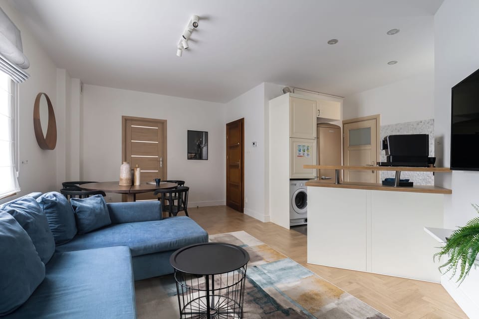 Deluxe Apartment, Balcony, Beachside | Living area | 40-inch flat-screen TV with cable channels