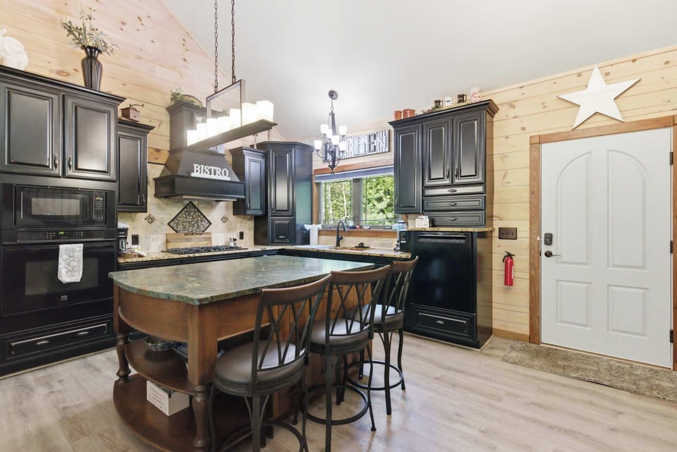The oversized island makes cooking, coffee, and conversation feel effortlessly connected.