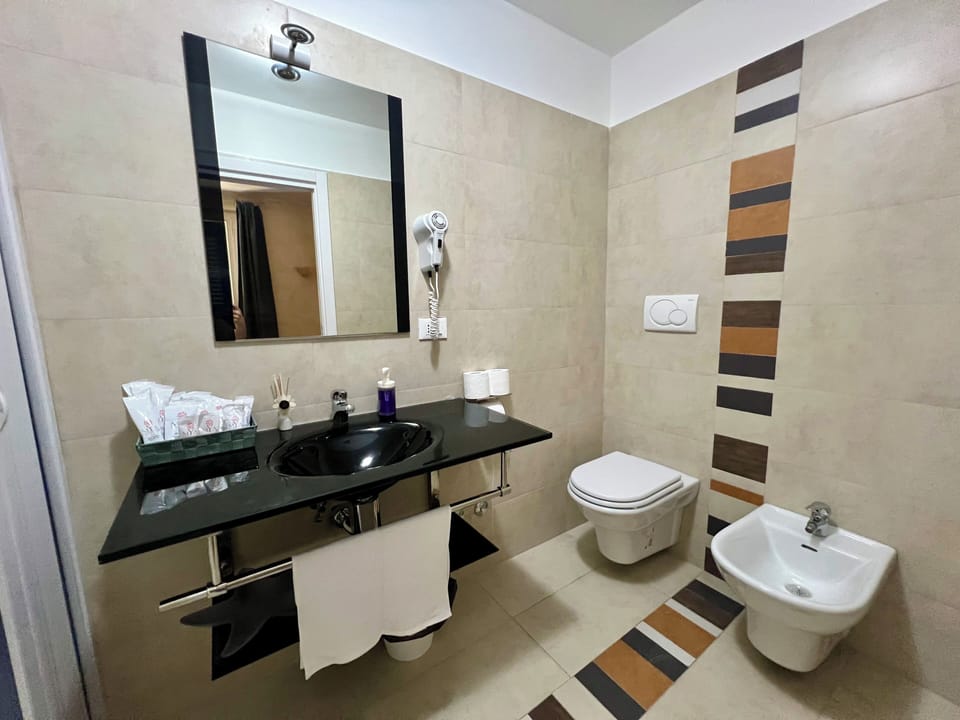 Quadruple Room | Bathroom | Hair dryer, towels, soap, shampoo
