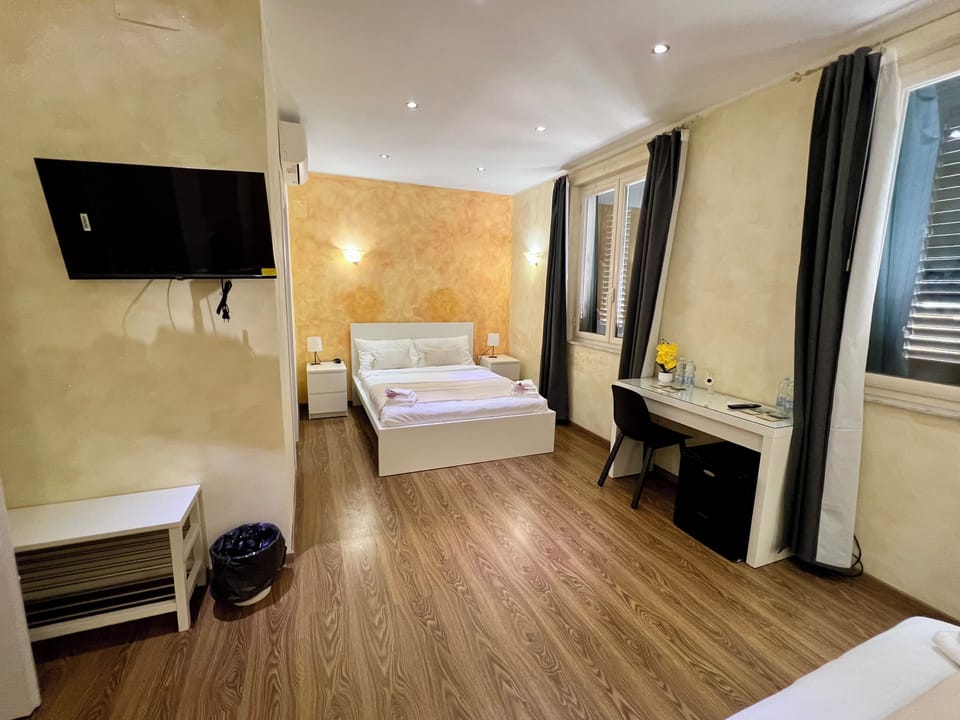 Quadruple Room | In-room safe, desk, laptop workspace, blackout drapes