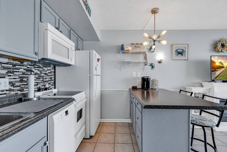 Signature Condo, 1 Bedroom, Ocean View, Oceanfront | Private kitchen | Fridge, microwave, oven, stovetop