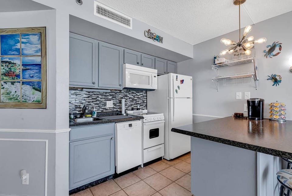 Signature Condo, 1 Bedroom, Ocean View, Oceanfront | Private kitchen | Fridge, microwave, oven, stovetop