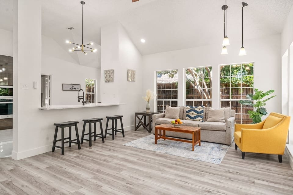 Chic living room featuring a cozy sectional and stylish decor that could double as a dedicated workspace.