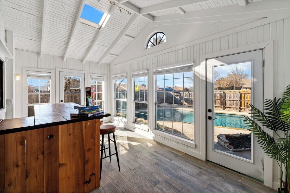 Host happy hour in the sunroom—your private indoor bar with seating for four and classic board games for laid-back fun.