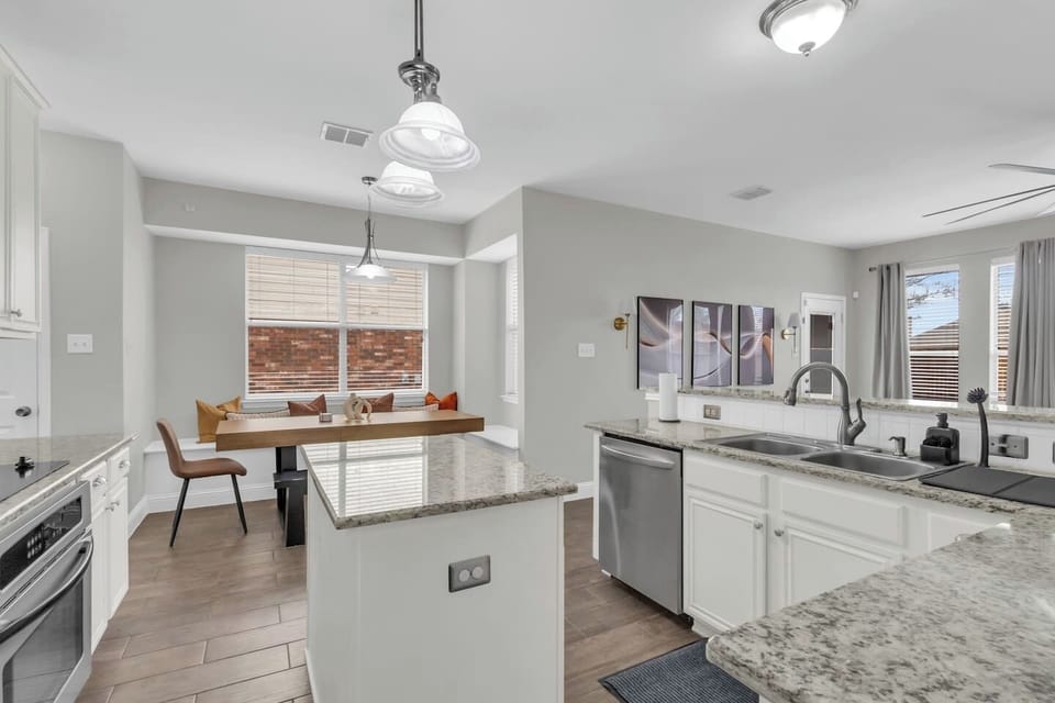Spacious, open-concept kitchen designed for group cooking, casual meals, and seamless flow into the dining and living areas.