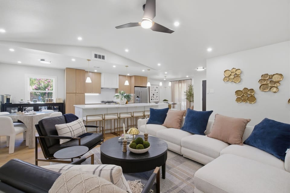 Open-Concept Layout connects the living room, kitchen, and dining area into one bright, vaulted space. Built for entertaining groups and families.