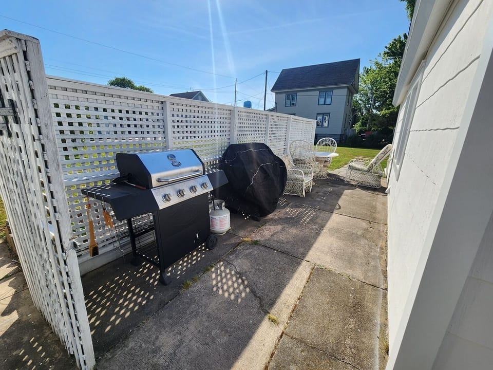 Outdoor grilling area equipped with two gas grills.