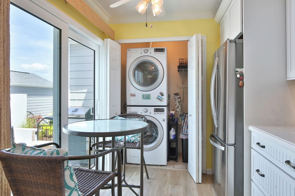 Your vacation home blends comfort and convenience with in-unit laundry and a cozy breakfast nook overlooking the neighborhood—perfect for morning coffee or casual meals.
