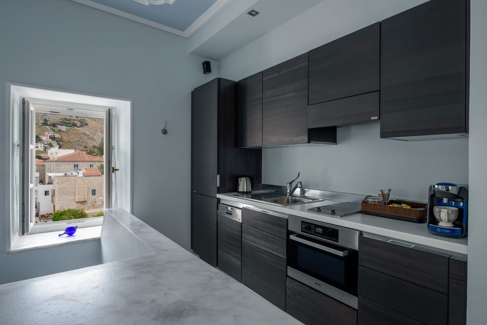 Executive Apartment | Private kitchen | Fridge, espresso maker, coffee/tea maker, electric kettle