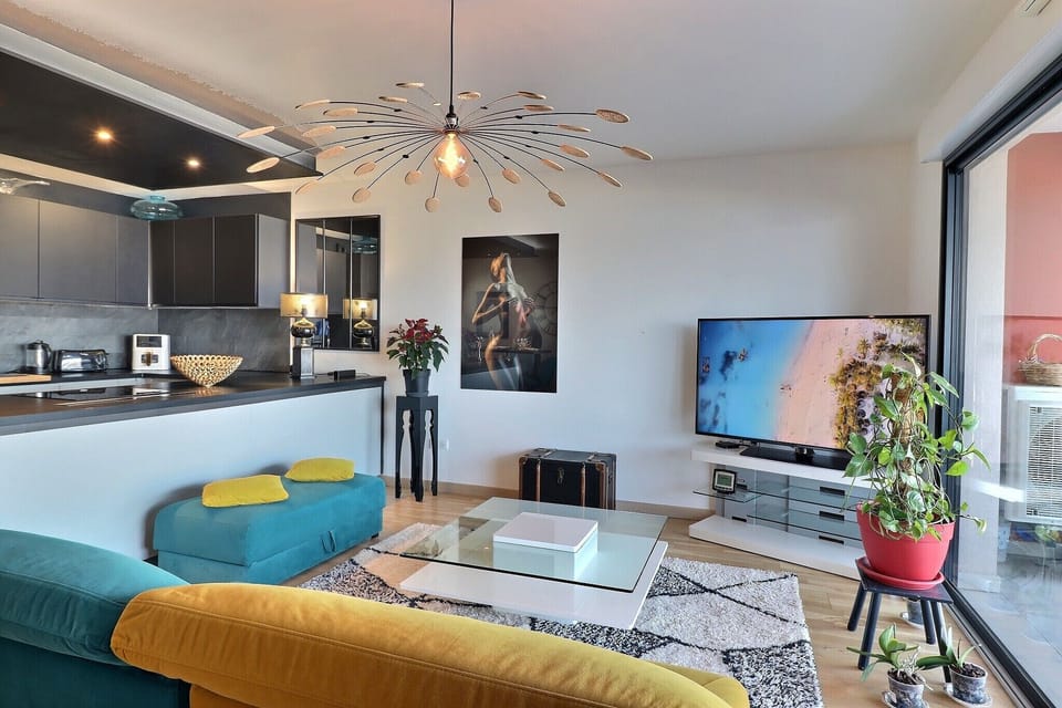 Comfort Apartment, Balcony, Beach View | Living area | 110-cm Smart TV with digital channels
