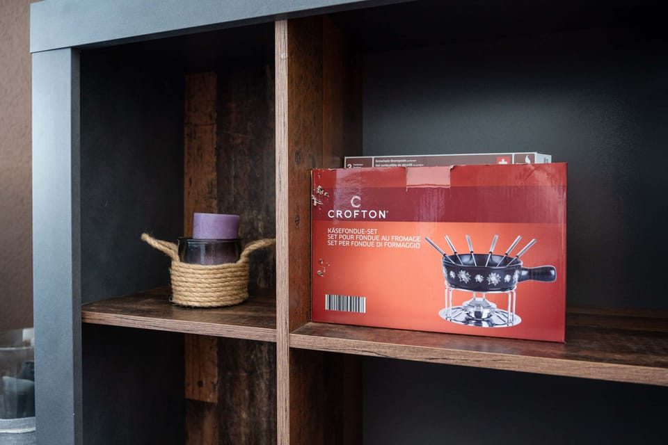 Living room shelf with fondue set
